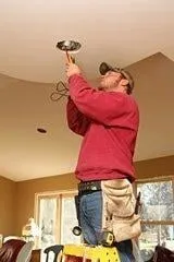 Professional electrician providing panel upgrade in ,