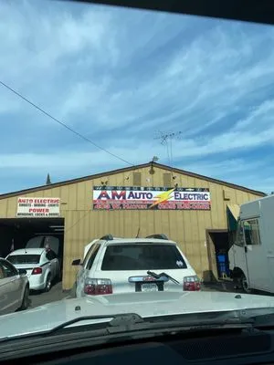 Am Auto Electric Logo