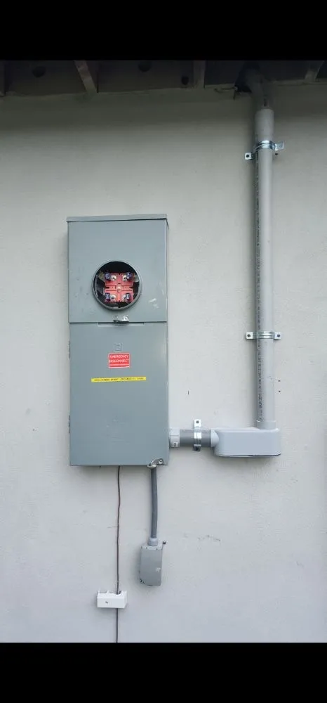 Professional electrician providing panel upgrade in ,
