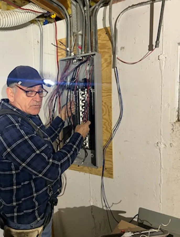 Professional electrician providing outlet and switch repair in , 