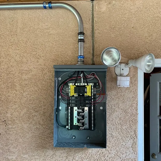 Emergency electrician providing panel upgrade in ,