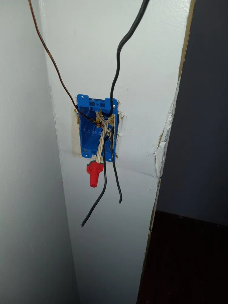 Licensed electrician providing outlet and switch repair in Rowland, NC - Custom Renovation