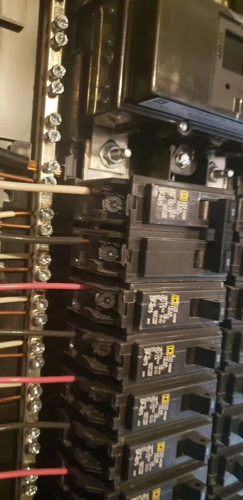 Certified electrician providing panel upgrade in St John, IN - Doss Electric