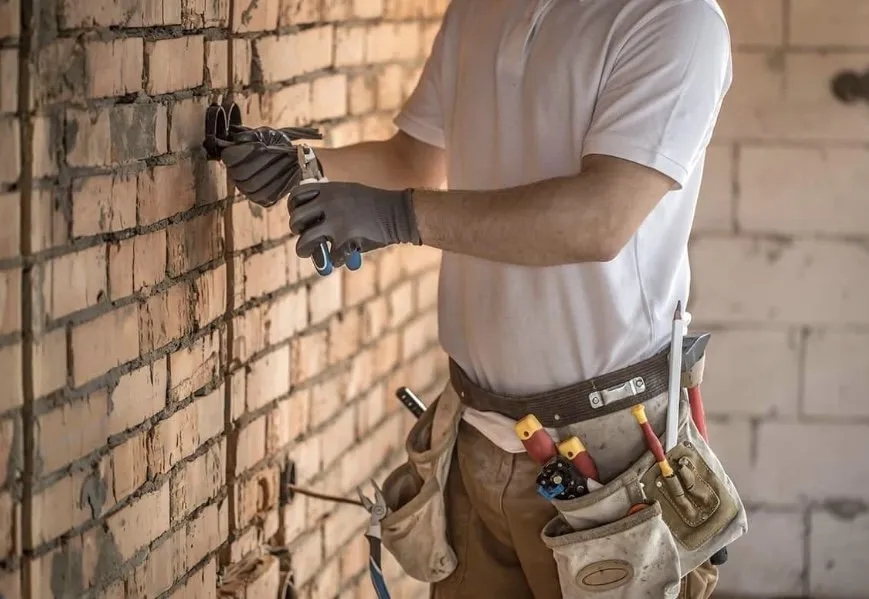 Professional electrician providing emergency electrical service in , 