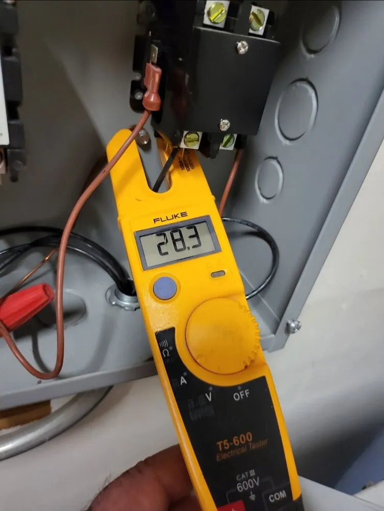 Emergency electrician providing panel upgrade in , 