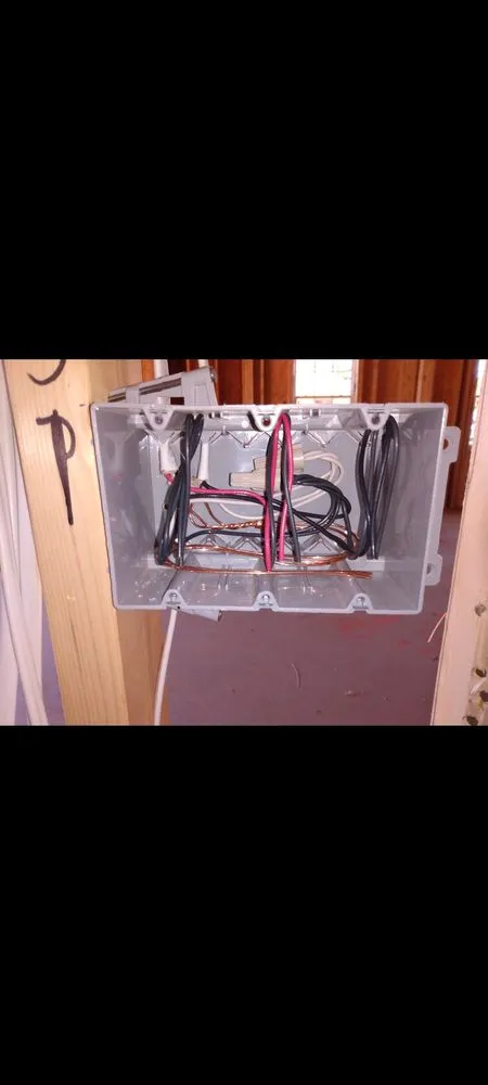 Professional electrician providing outlet and switch repair in , 