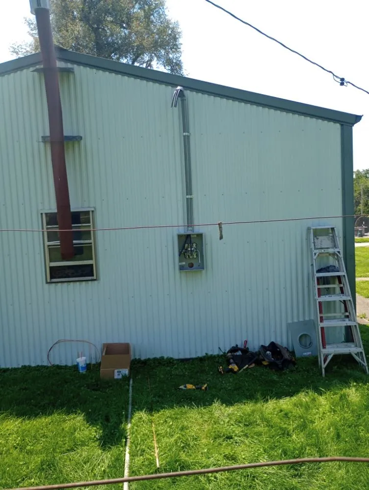 Licensed electrician providing panel upgrade in ,