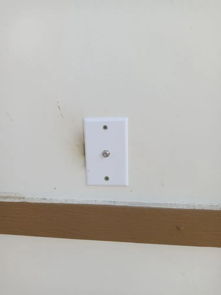 Professional electrician providing outlet and switch repair in , 