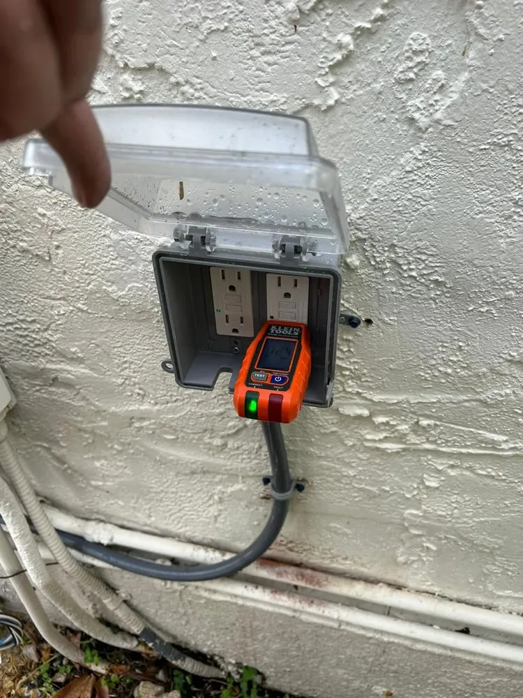 Professional electrician providing outlet and switch repair in ,