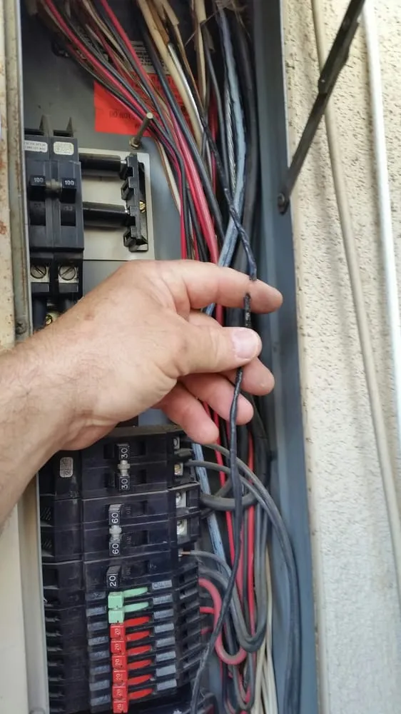 Professional electrician providing panel upgrade in , 