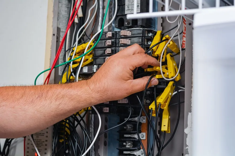 Emergency electrician providing panel upgrade in , 