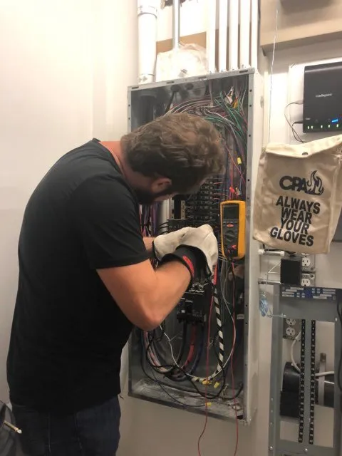 Expert electrician providing panel upgrade in , 