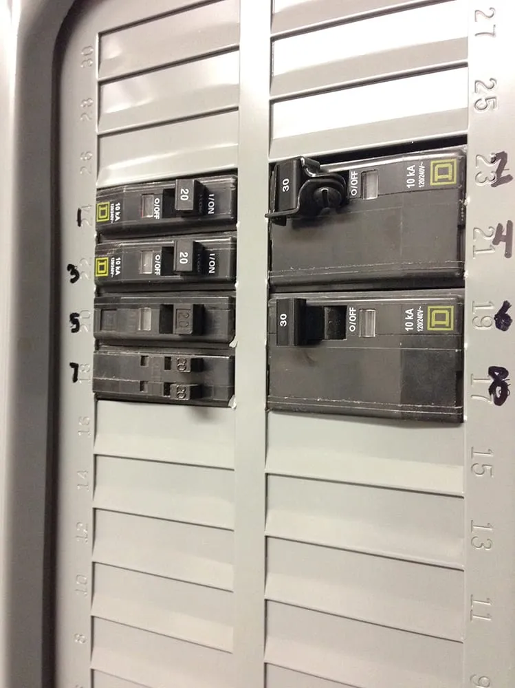 Professional electrician providing circuit breaker repair in ,