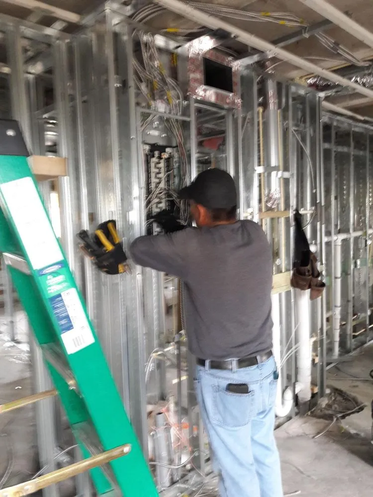 Professional electrician providing circuit breaker repair in Opa-locka, FL - Infinity at your service