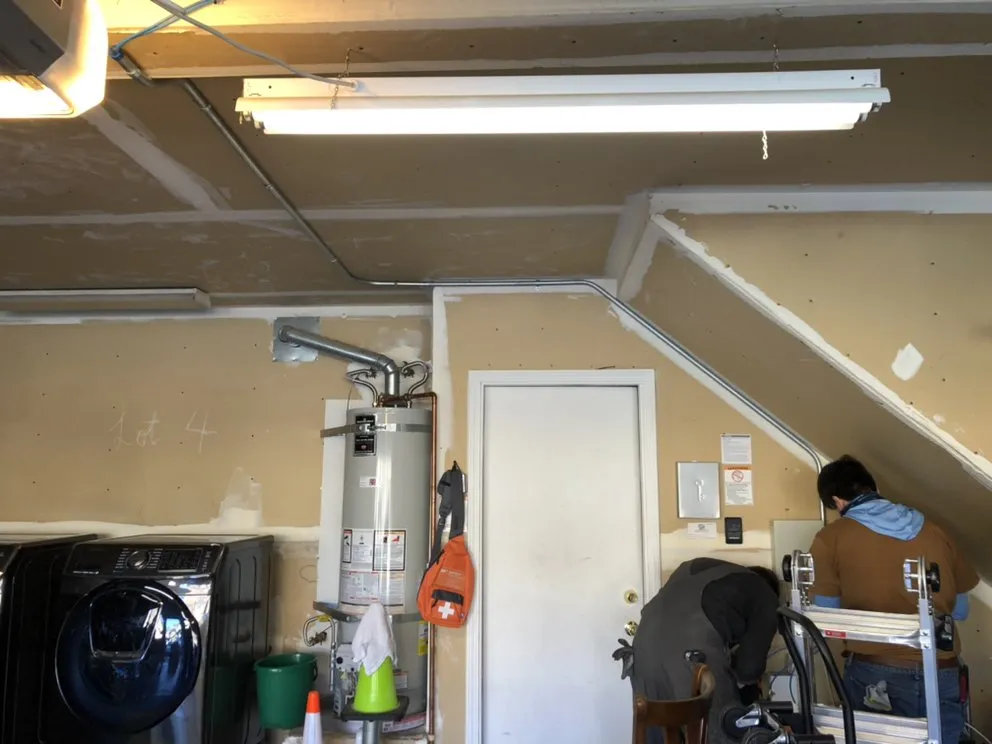 Emergency electrician providing panel upgrade in , 