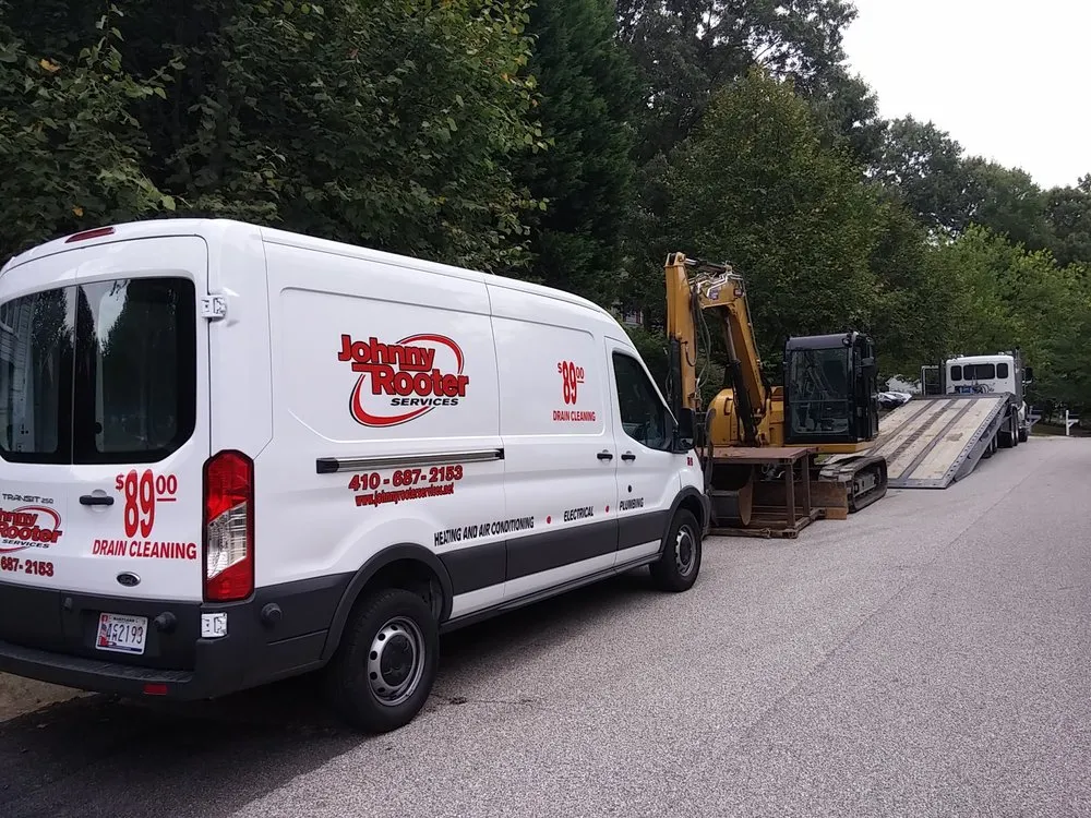 Slide of Johnny Rooter Services