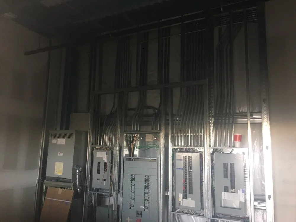 Emergency electrician providing panel upgrade in ,