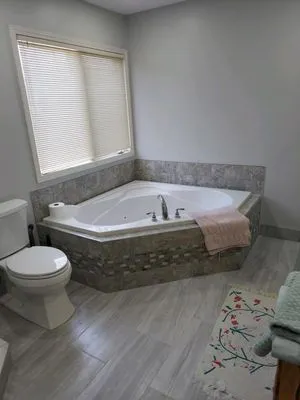 Lila Do All Construction Logo