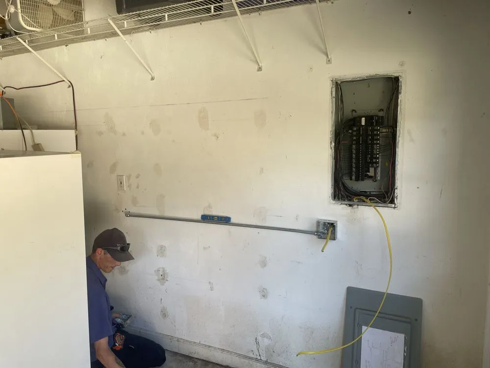 Emergency electrician providing panel upgrade in , 