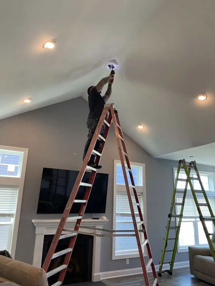 Professional electrician providing outlet and switch repair in ,