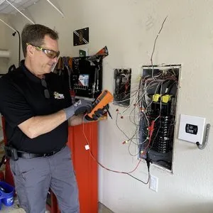 Emergency electrician providing panel upgrade in , 