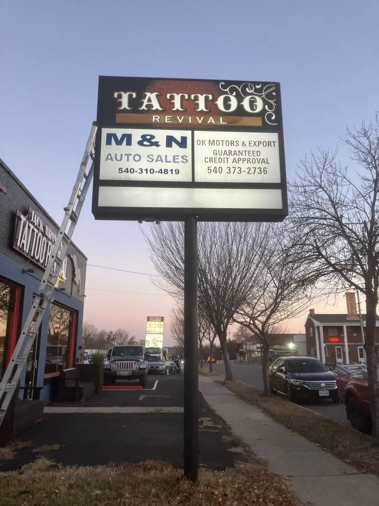 Slide of Nova Sign Guys