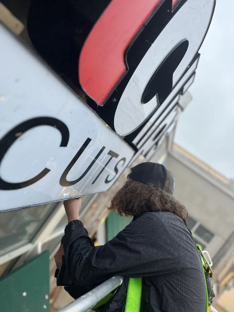 Slide of Nova Sign Guys