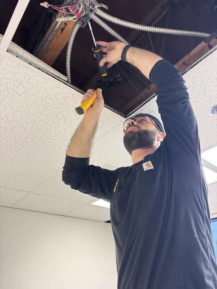 Slide of OC Electricians, by Osta