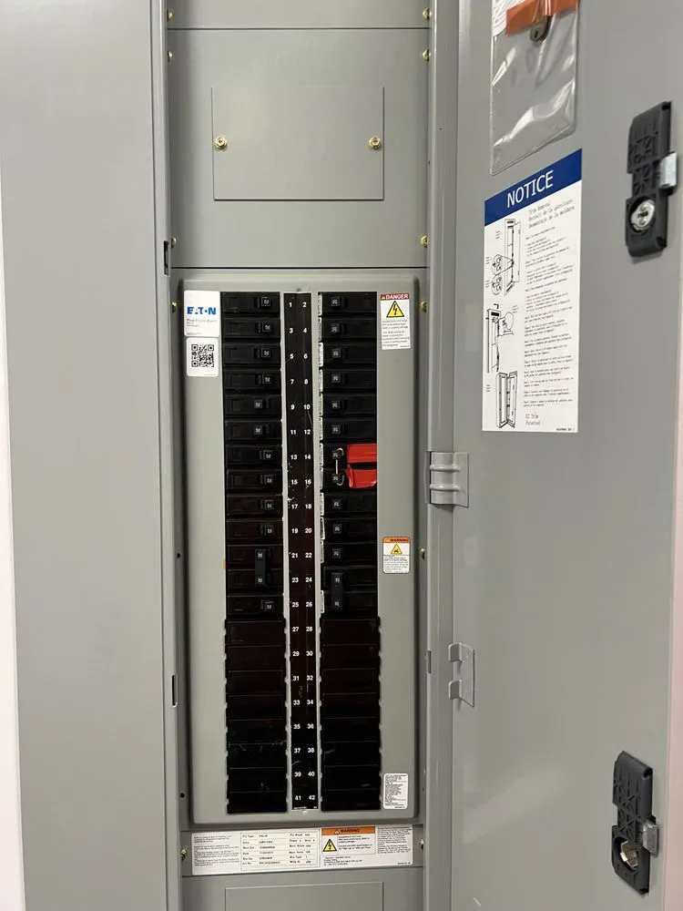 Licensed electrician providing panel upgrade in ,