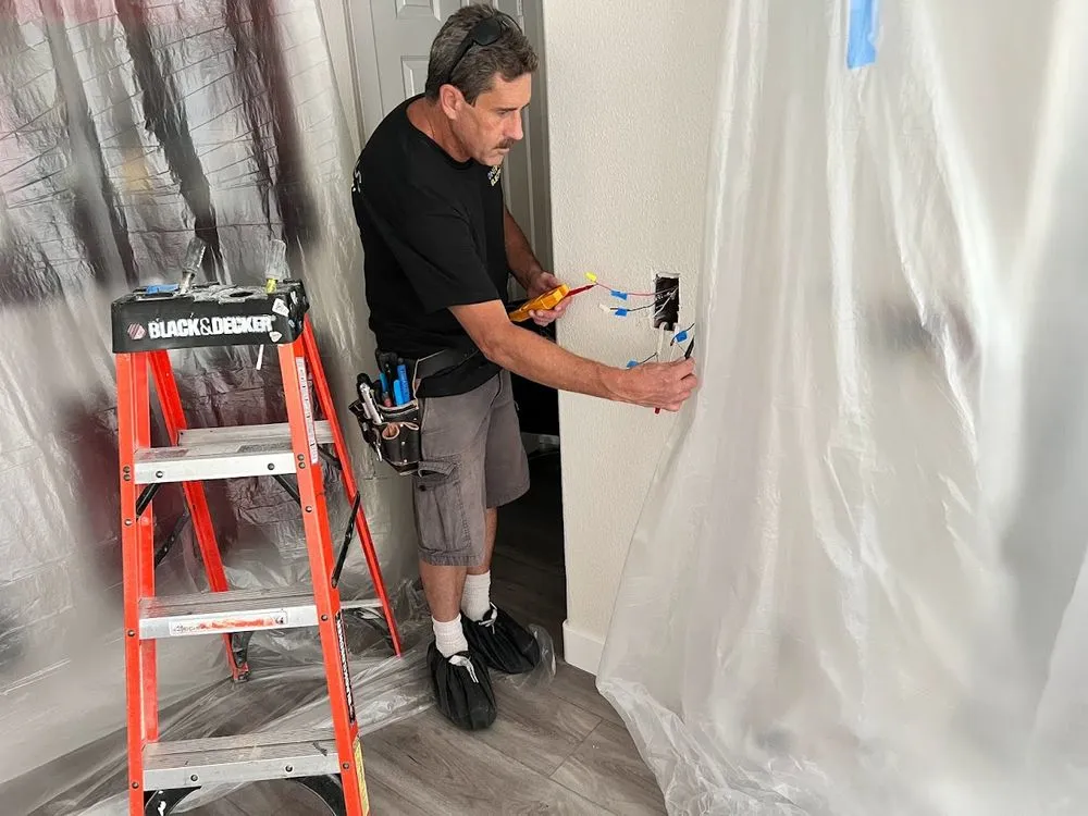 Emergency electrician providing panel upgrade in , 