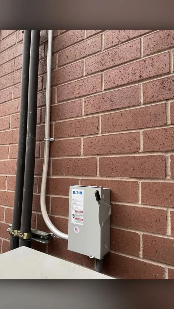 Certified electrician providing panel upgrade in , 