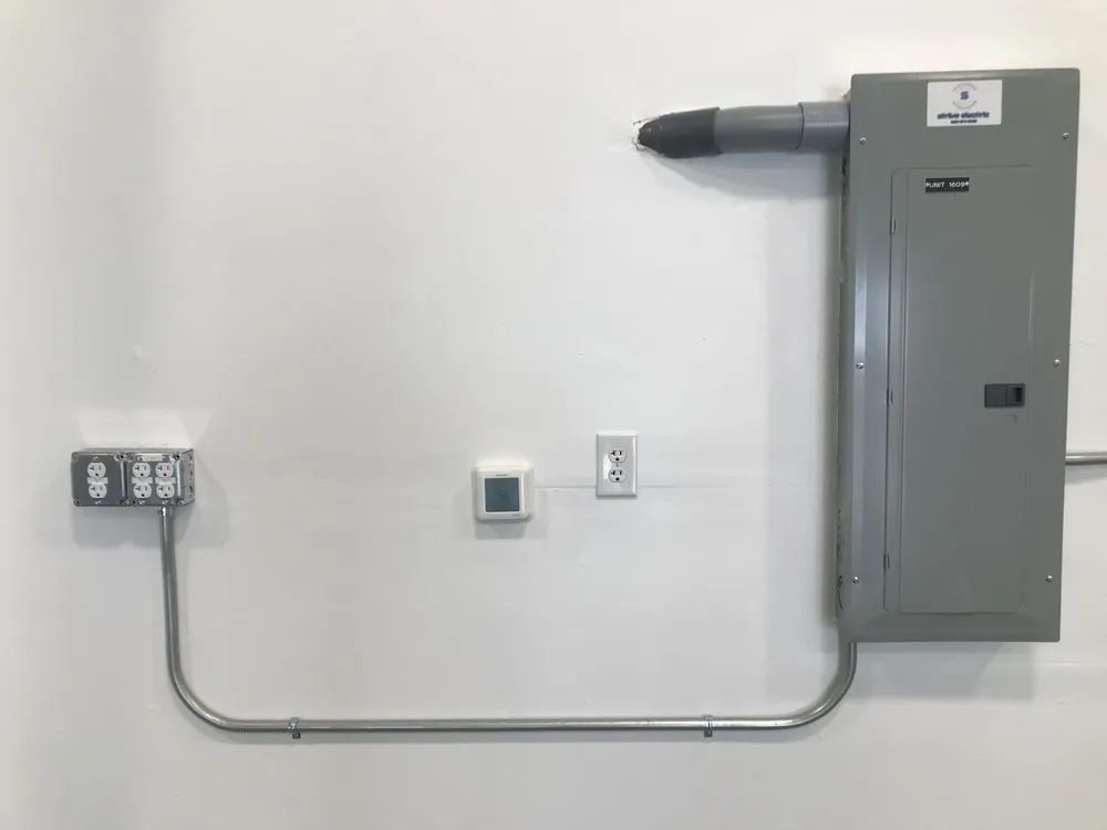 Emergency electrician providing panel upgrade in ,