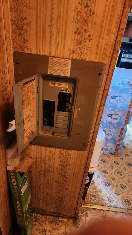 Professional electrician providing panel upgrade in , 