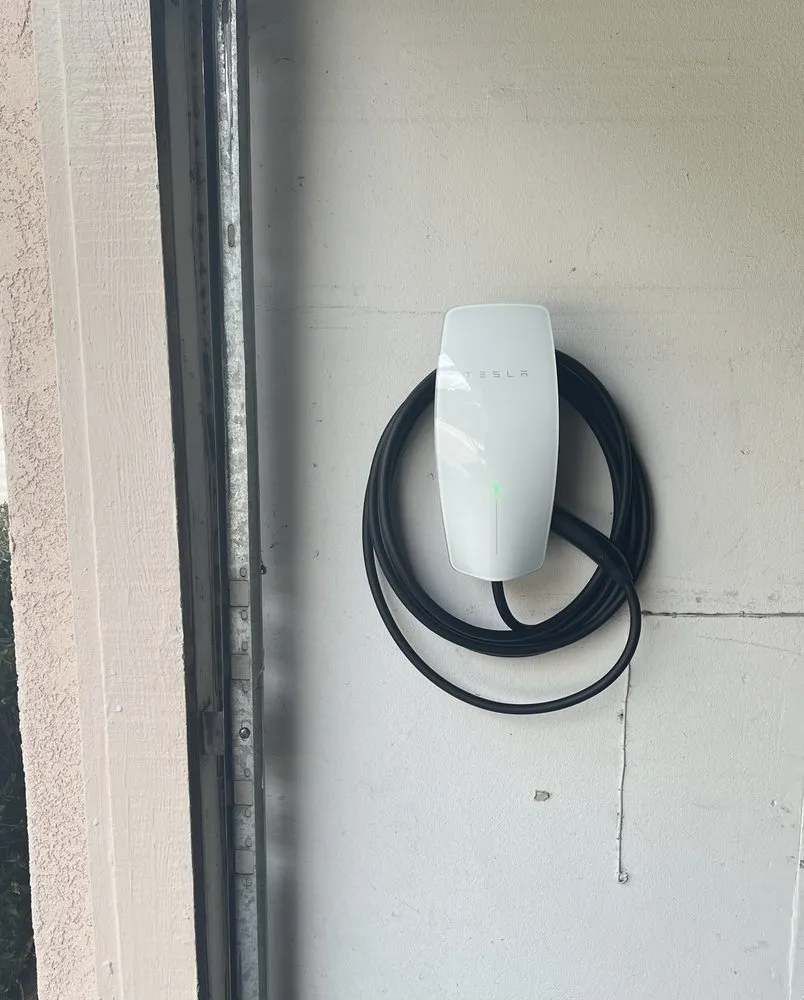 Slide of Tesla Electrical Services