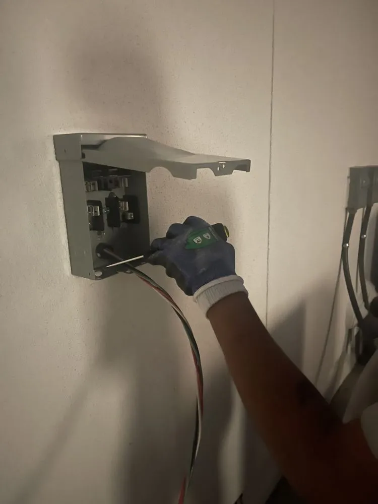 Expert electrician providing panel upgrade in , 